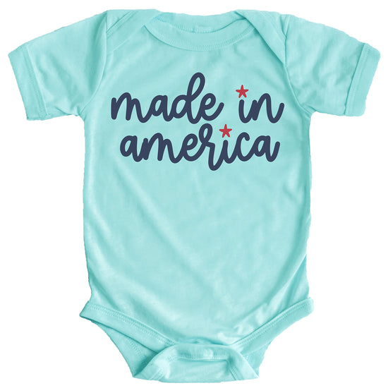 Baby bodysuit with Made in America 4th of July graphic print in white on pink