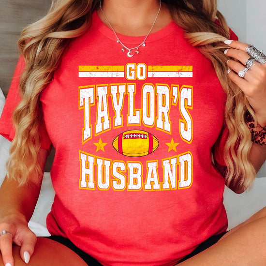 Women's vintage red Go Taylor's Husband funny football tee — front view of screen-printed game day graphic