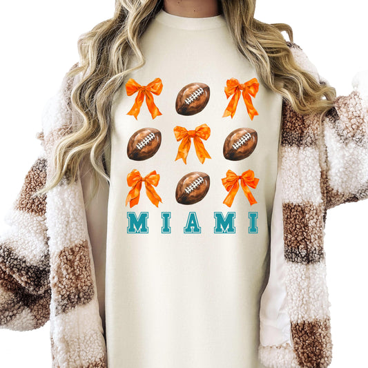 Trendy Miami Football Shirt for Women and Teens Girly Orange Bows and Footballs Florida Team Tee Ivory Shirt Adult Medium