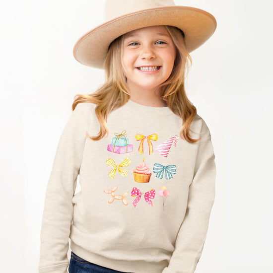 Olive Loves Apple pastel birthday sweatshirt for girls in soft pink with bow and cupcake design