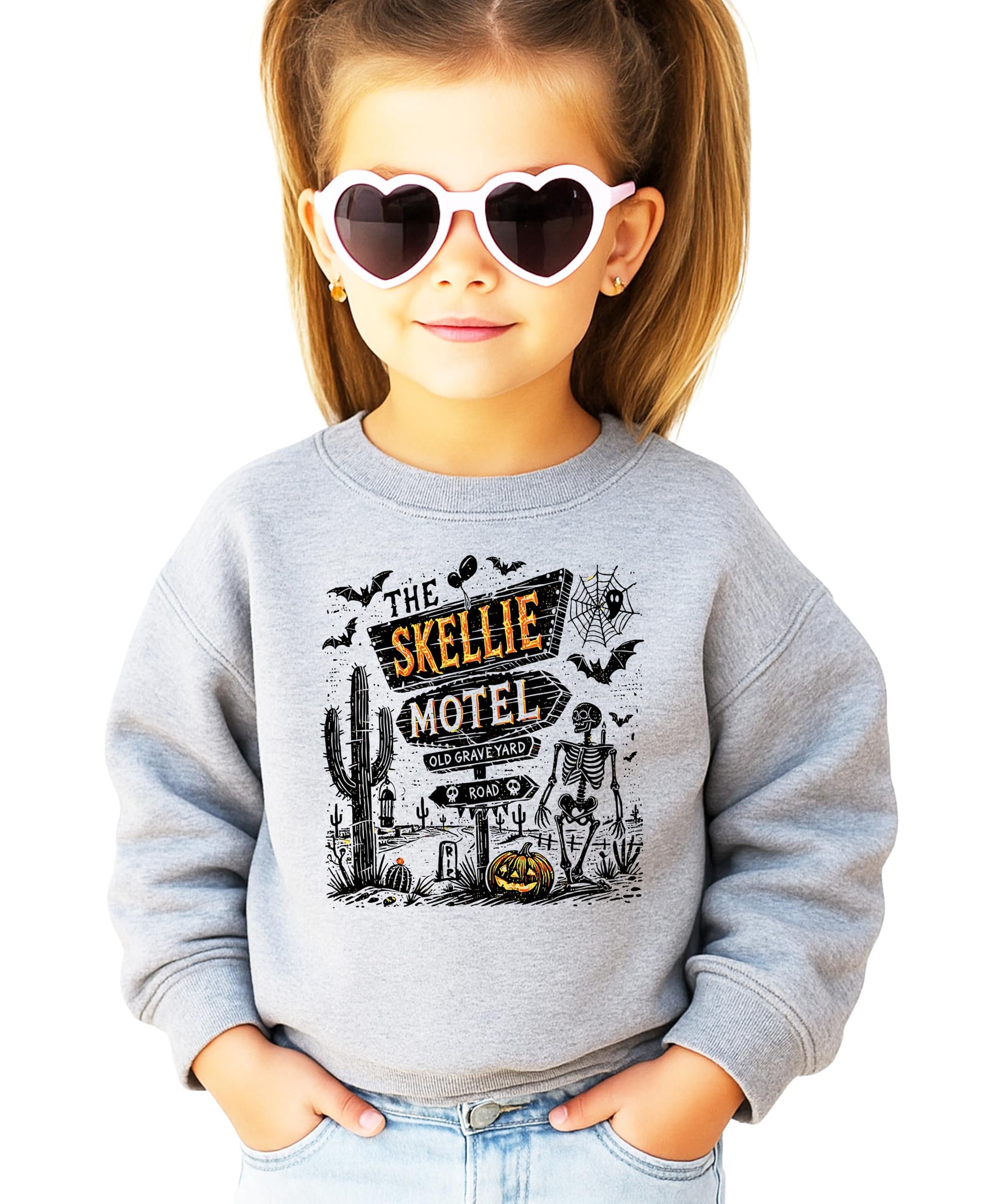 Close-up of The Skellie Hotel skeleton and haunted motel graphic print on soft crewneck sweatshirt