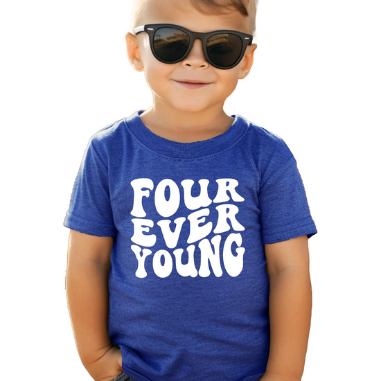 Detail shot of vibrant Four Ever Young birthday graphic on kids' tee