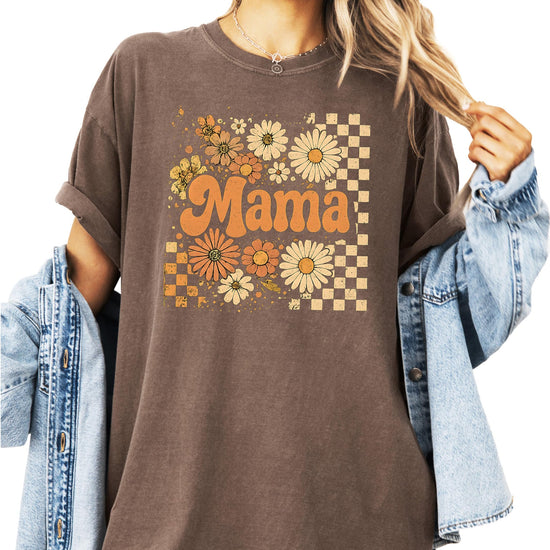 Close-up view of sunflower floral and checkered graphic design on fall mama shirt