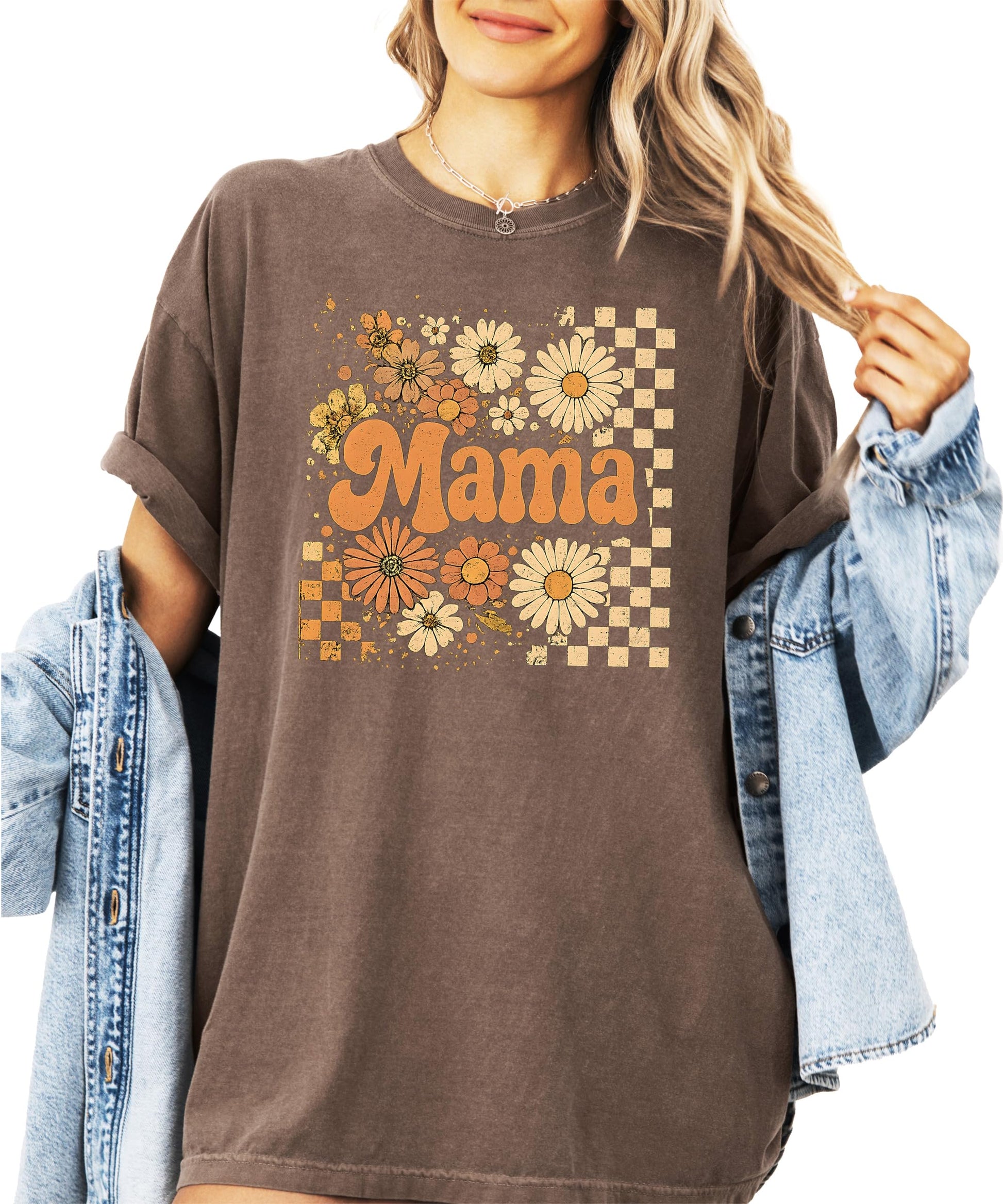 Close-up view of sunflower floral and checkered graphic design on fall mama shirt