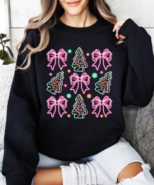 Front view of neon holiday graphic sweatshirt featuring colorful bows and Christmas trees on black fabric
