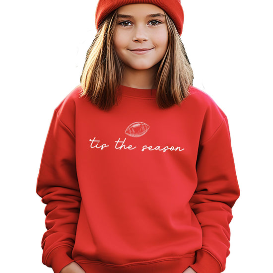 Close-up of 'Tis the Season script and football graphic print on soft sweatshirt fabric