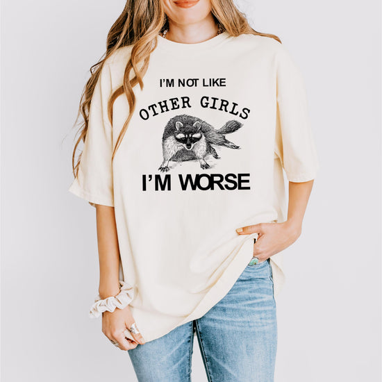 Pepper color women's graphic tee with raccoon design and humorous slogan