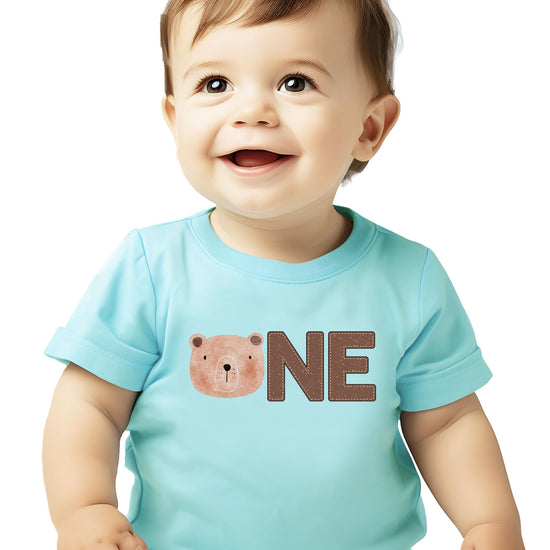Baby boy in bear ONE birthday shirt styled for a first birthday party