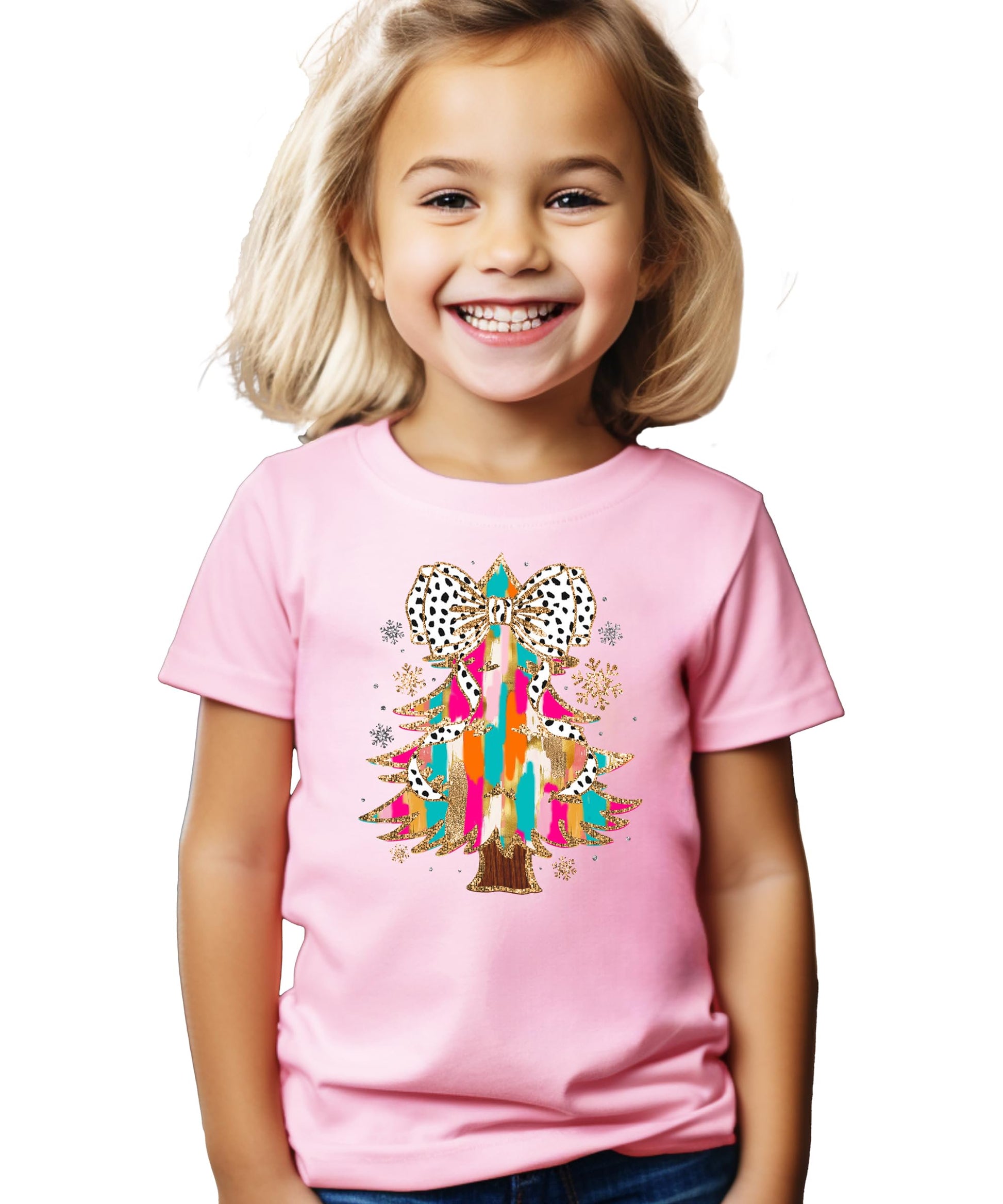 Model wearing pink holiday graphic tee with colorful glitter Christmas tree and coquette bow design