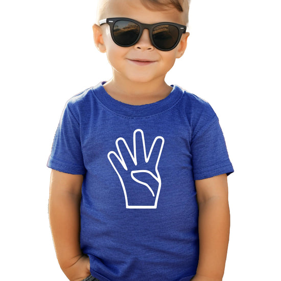 Kids wearing black fourth birthday graphic tee in a fun casual setting