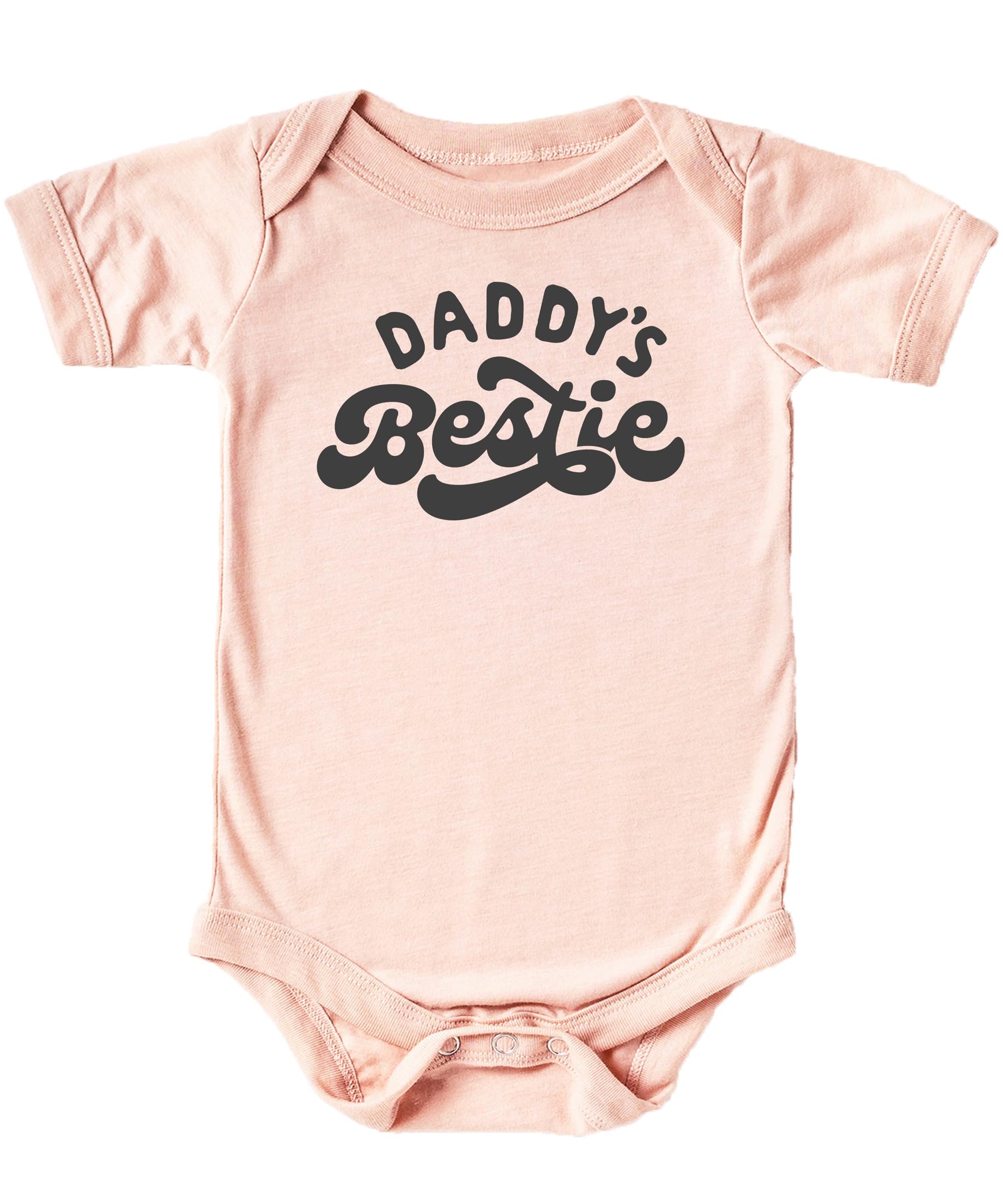 Close-up of Daddy's Bestie retro graphic print on a soft peach baby one-piece bodysuit