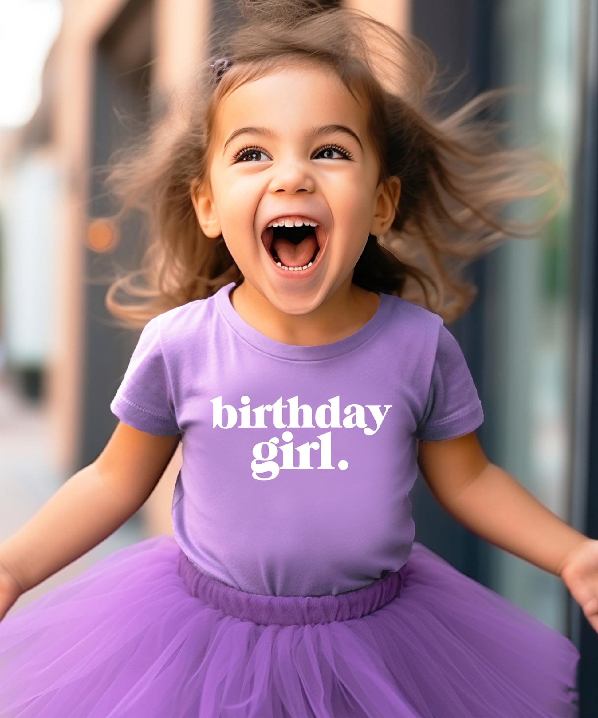 Toddler girl wearing purple Birthday Girl Period graphic shirt from Olive Loves Apple