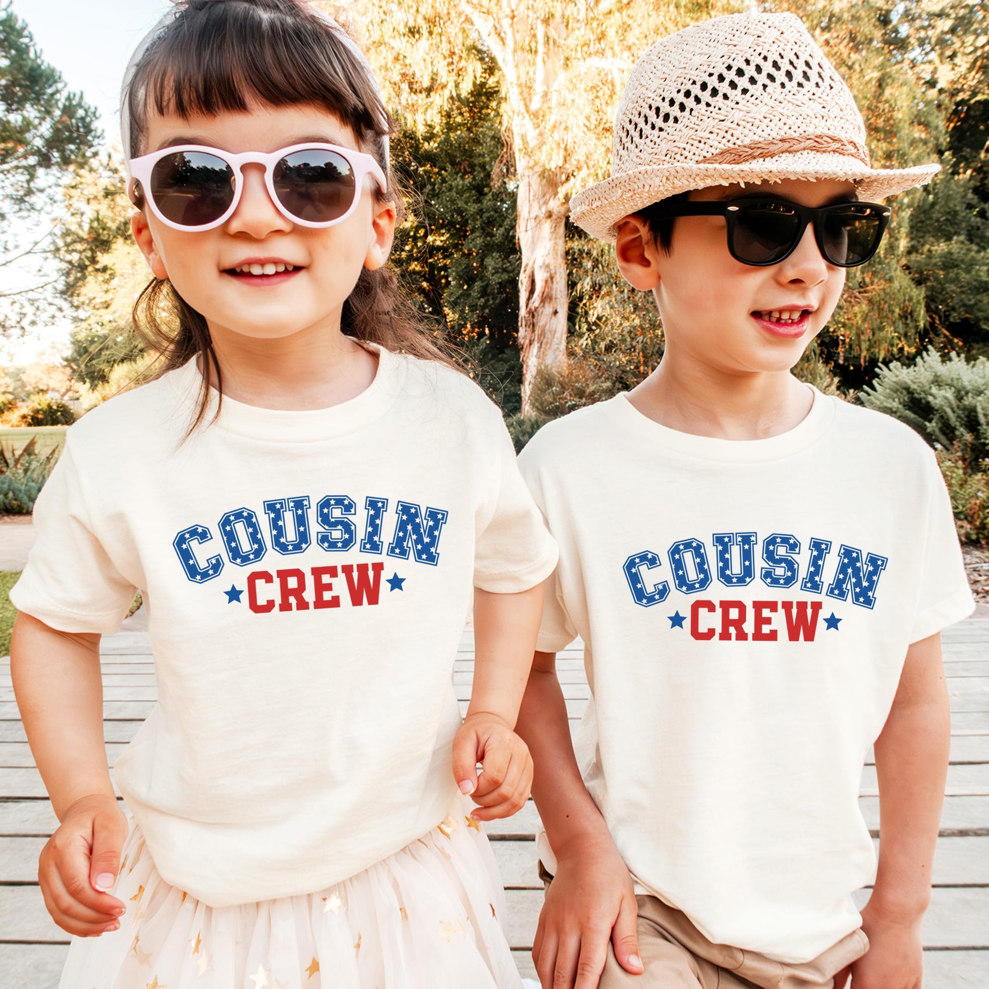Close-up view of USA Cousin Crew text design on natural kids shirt