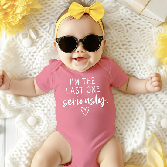 Olive Loves Apple funny newborn bodysuit in white with mauve accent, perfect for baby shower gifting
