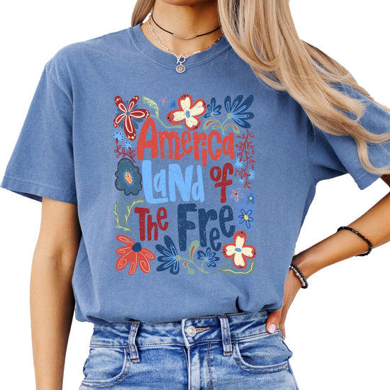 Back view of America Land of the Free floral graphic tee for women and teens