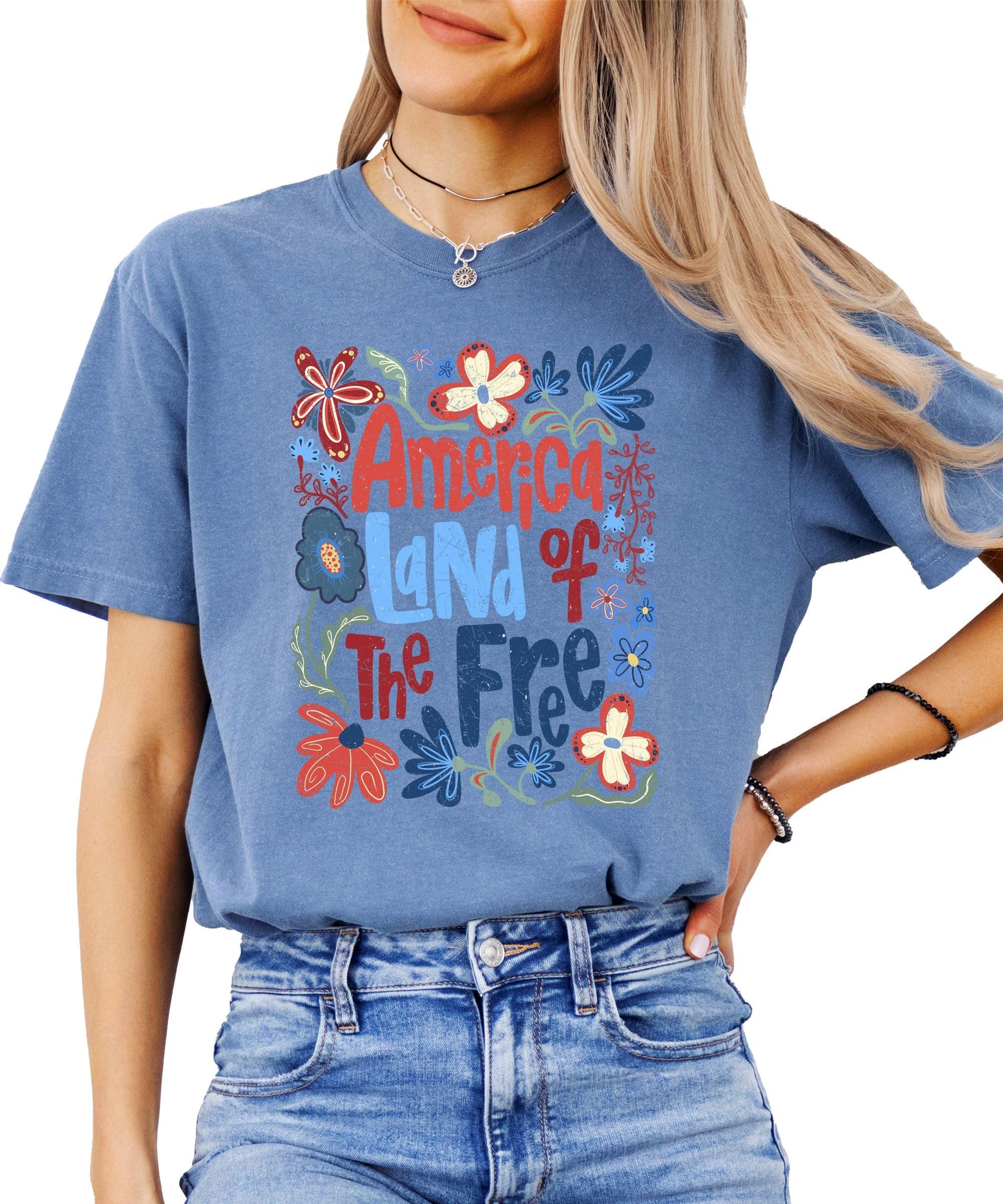 Back view of America Land of the Free floral graphic tee for women and teens