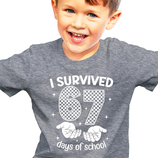 Close-up of 67 Days of School funny meme graphic print on kids tee