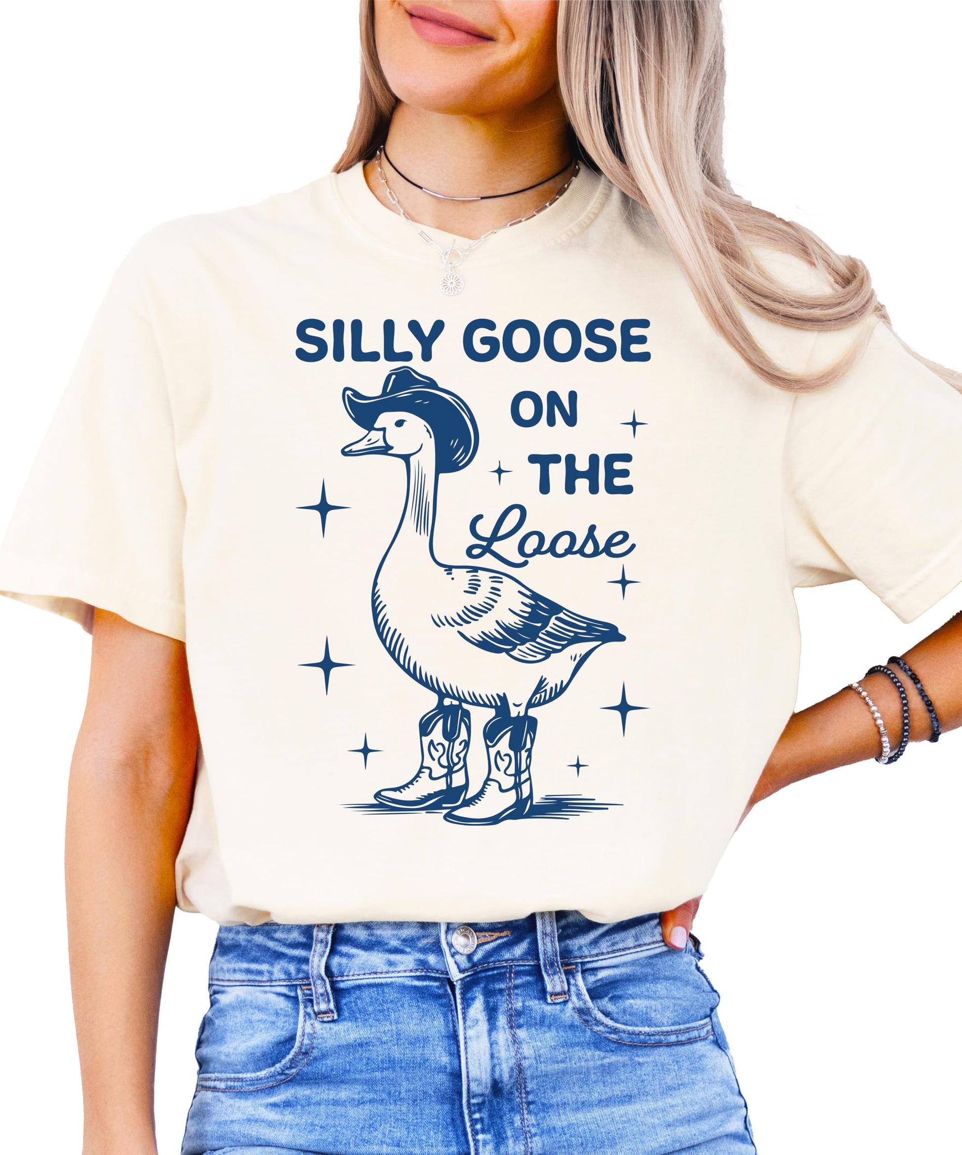 Silly Goose on the Loose ivory oversized t-shirt with cartoon goose in cowboy boots and hat