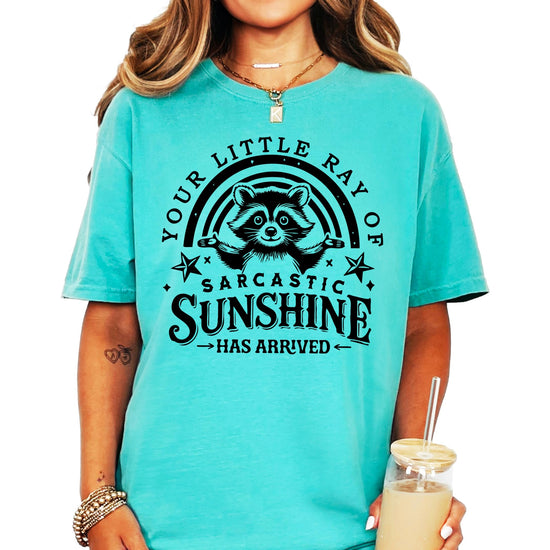 Product mockup showing ivory raccoon sarcastic sunshine t-shirt design