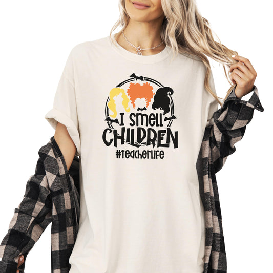 Ivory Halloween teacher t-shirt with 'I Smell Children' witches graphic printed on front