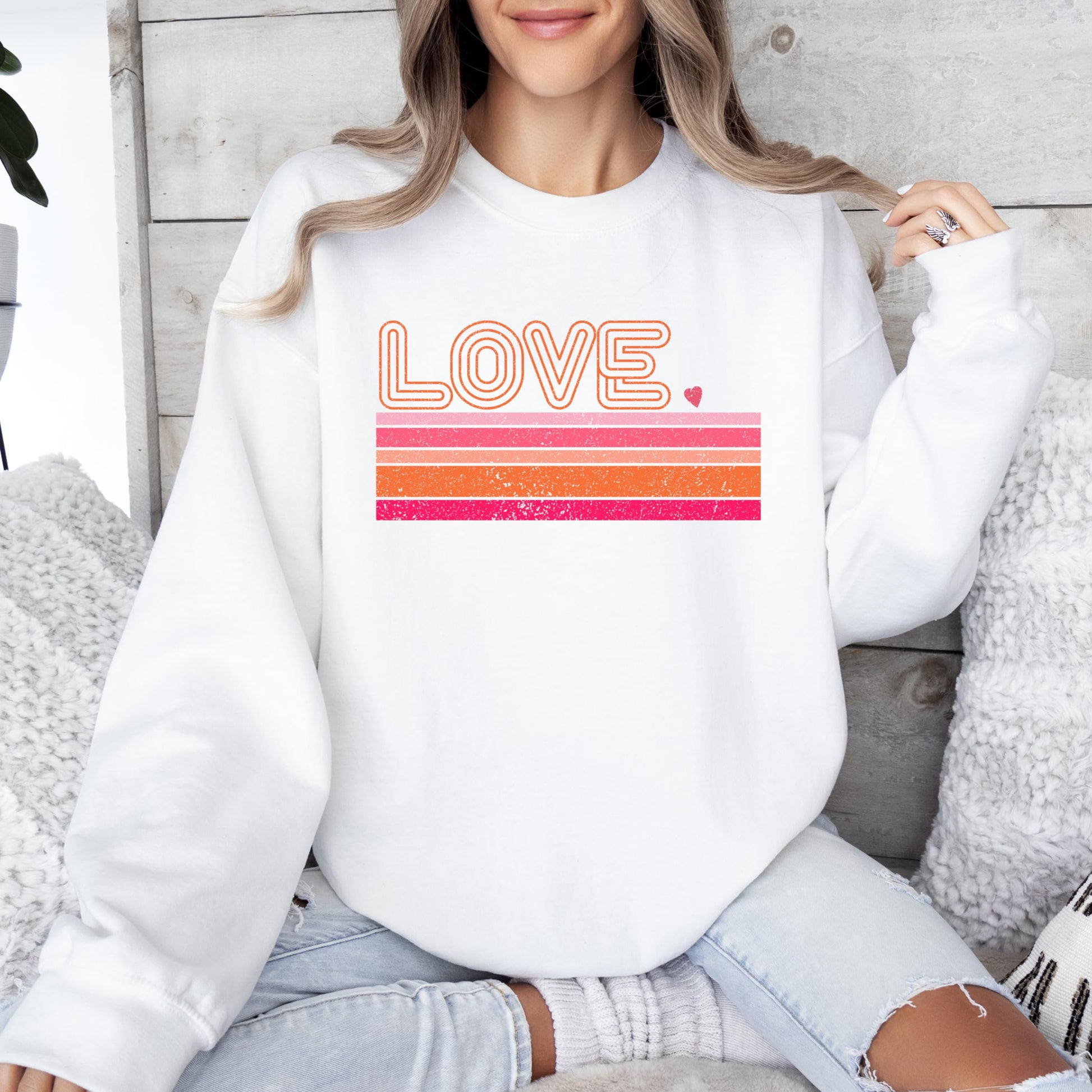 Adult gray Valentine's sweatshirt with bold retro groovy Love design, front view