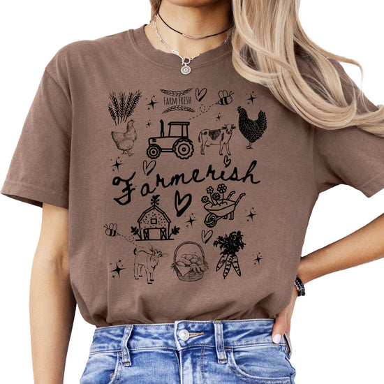 Women's farmerish graphic tee with hand-drawn farm icons including cows, chickens, tractors, and barns