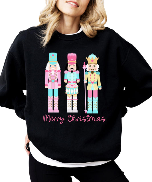 Pastel nutcracker Merry Christmas sweatshirt with colorful holiday design on black pullover