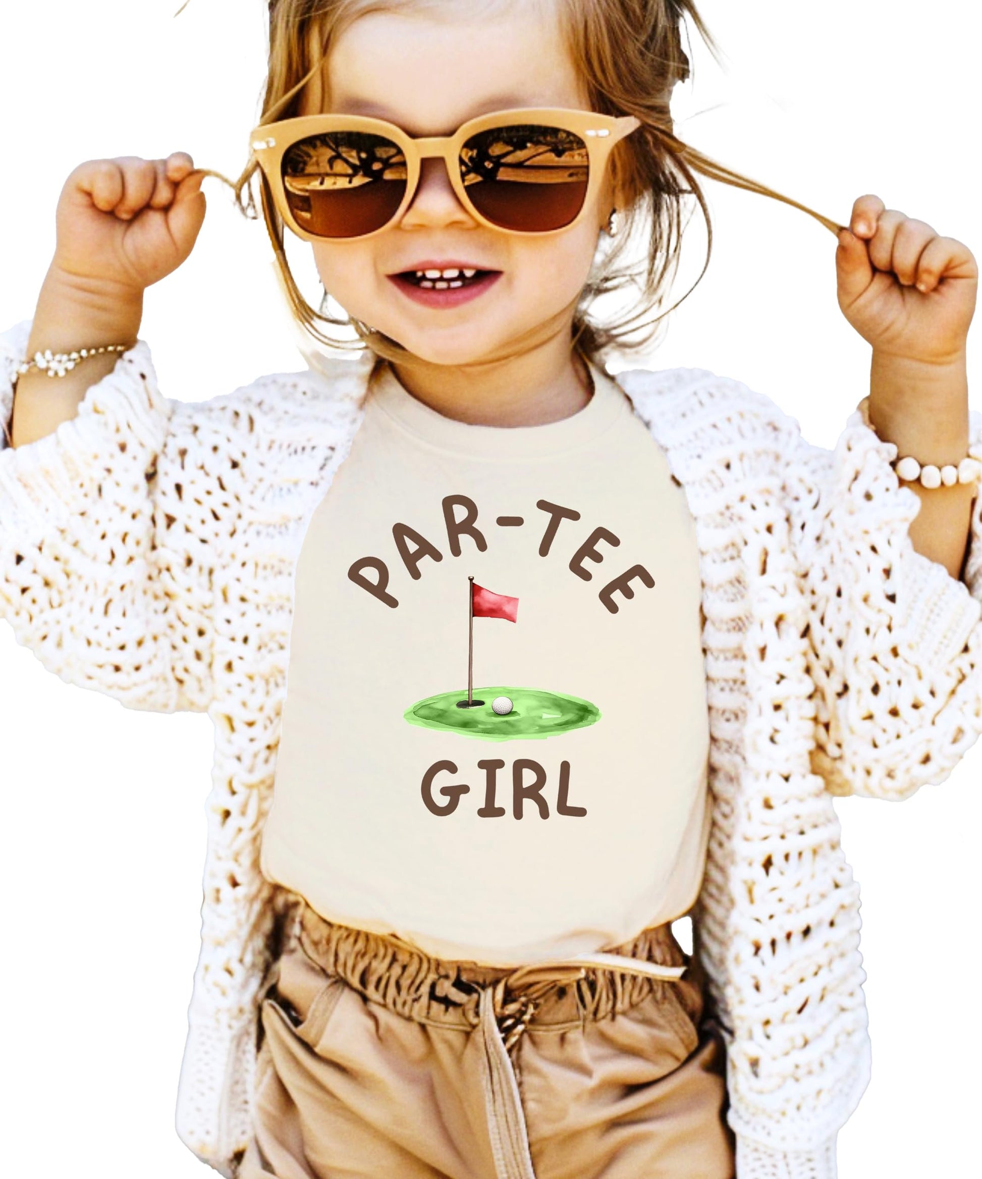 Girl wearing Par-Tee Girl golf birthday graphic tee in natural color