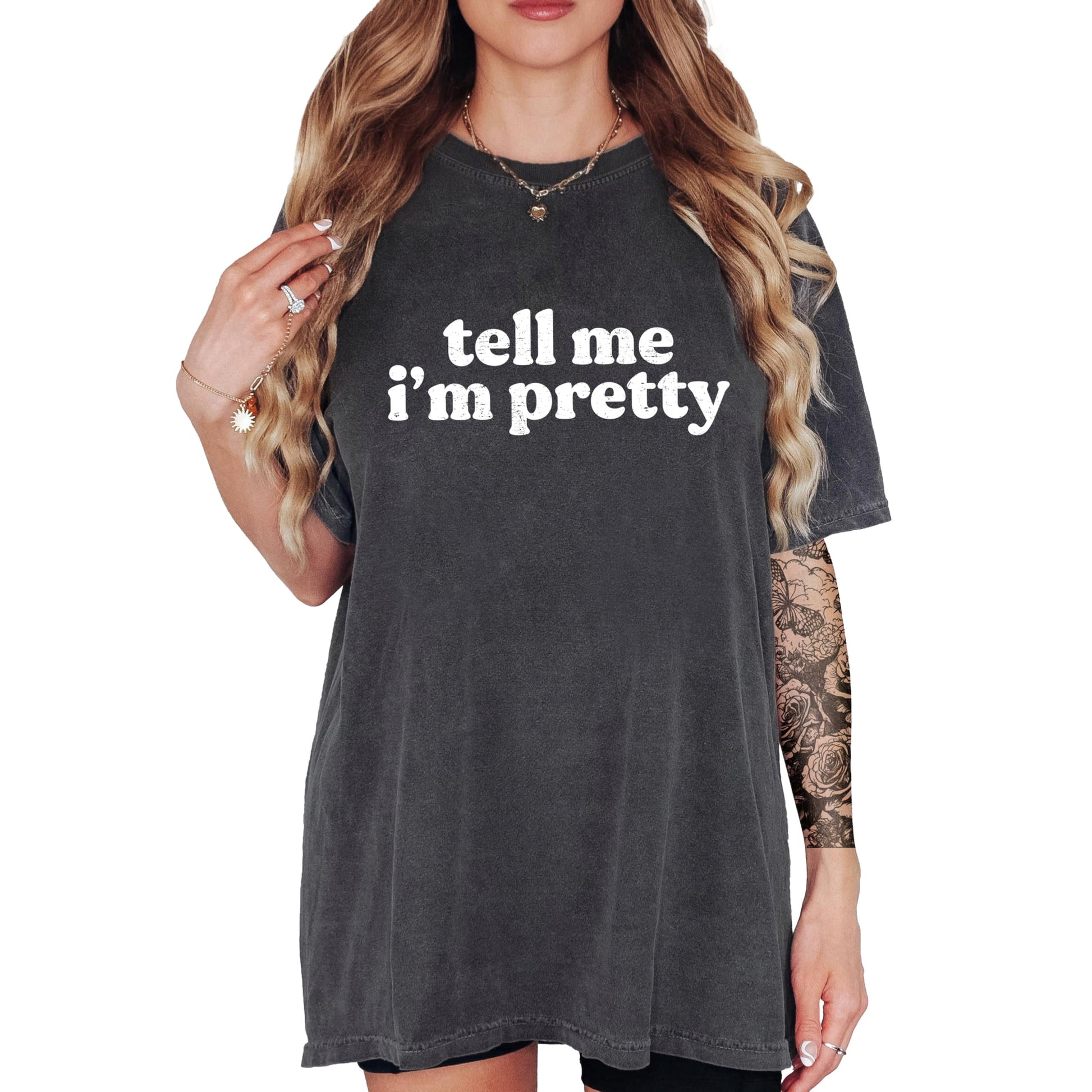 Close-up of Tell Me I'm Pretty graphic print on ivory women's t-shirt