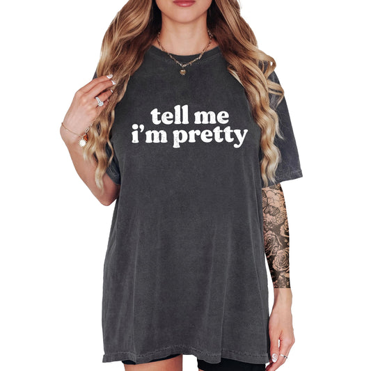 Close-up of Tell Me I'm Pretty graphic print on ivory women's t-shirt