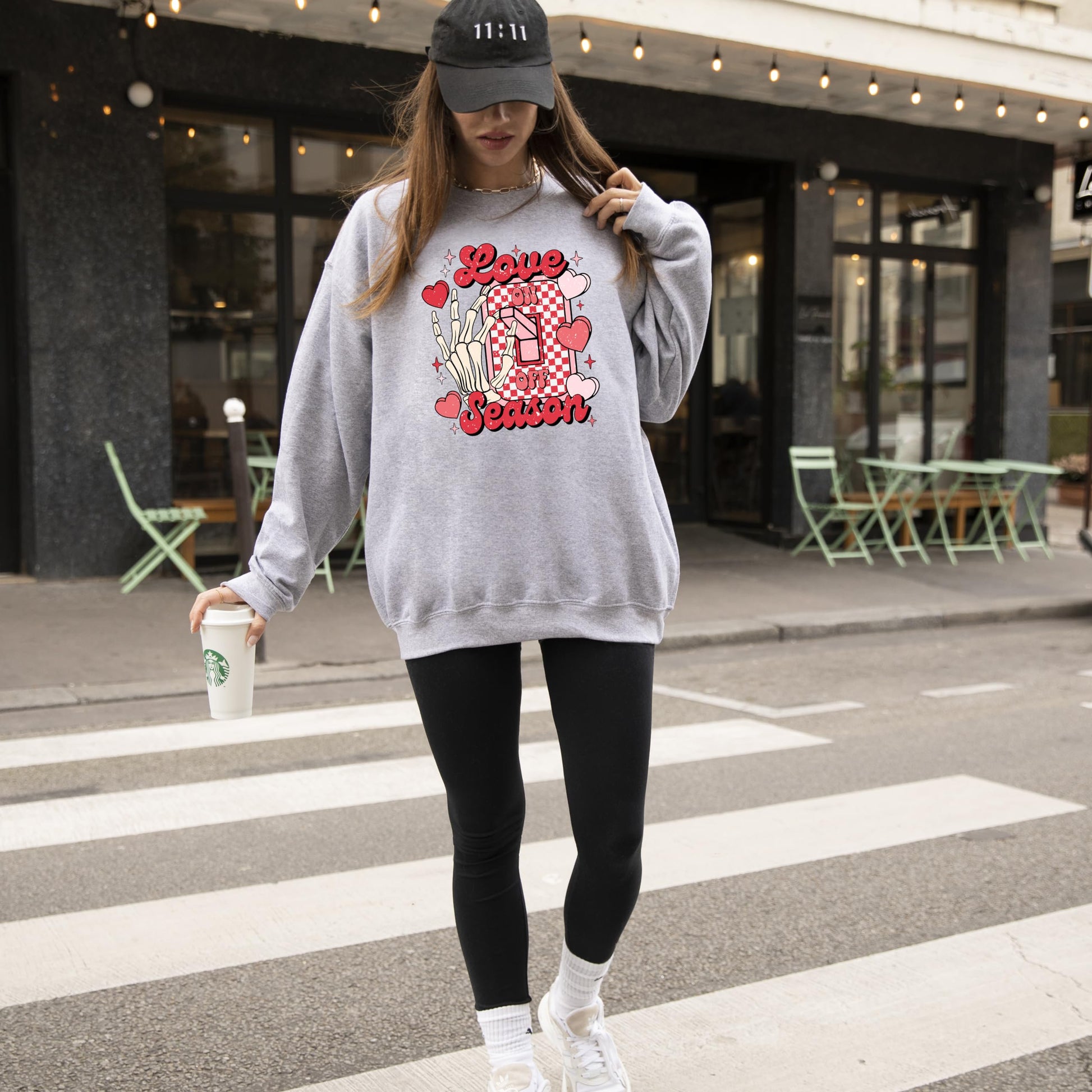 Olive Loves Apple Valentine's sweatshirt styled casually, showing full front graphic design