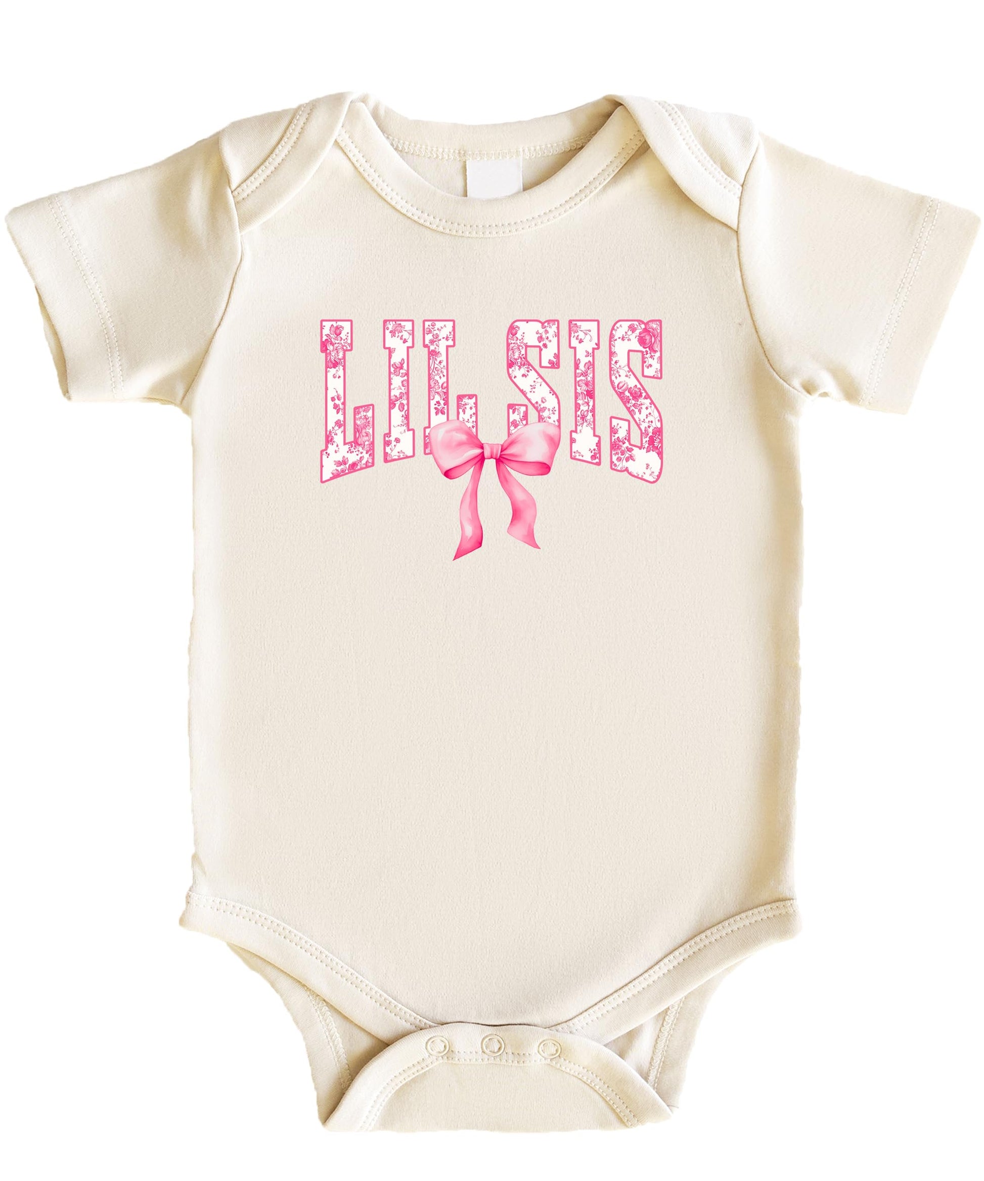 Close-up of floral graphic and pink bow design on a natural one-piece baby bodysuit