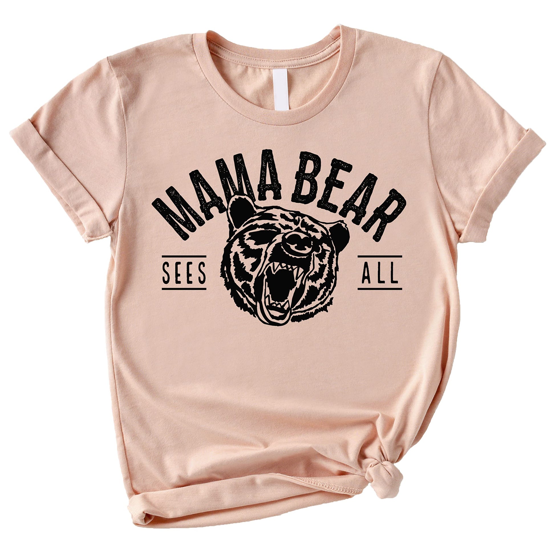 Peach Mama Bear Sees All shirt laid flat showing full graphic detail