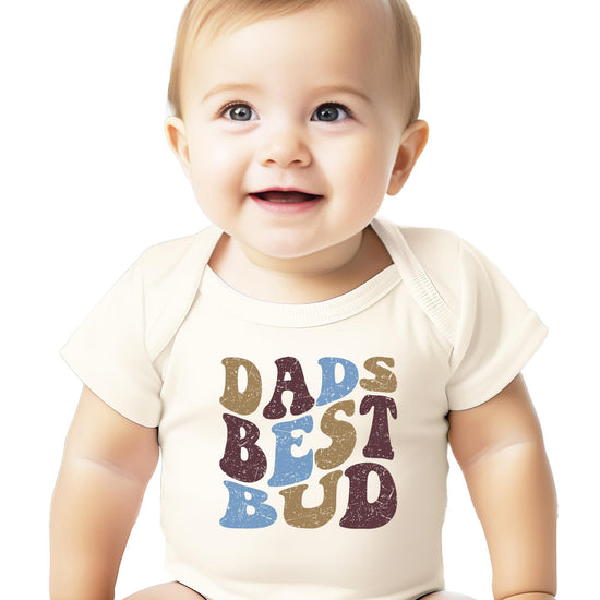 Close-up of vintage-style lettering on Dad's Best Bud natural baby onesie