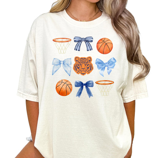 Close-up of Tigers basketball bow graphic print on ivory women's tee