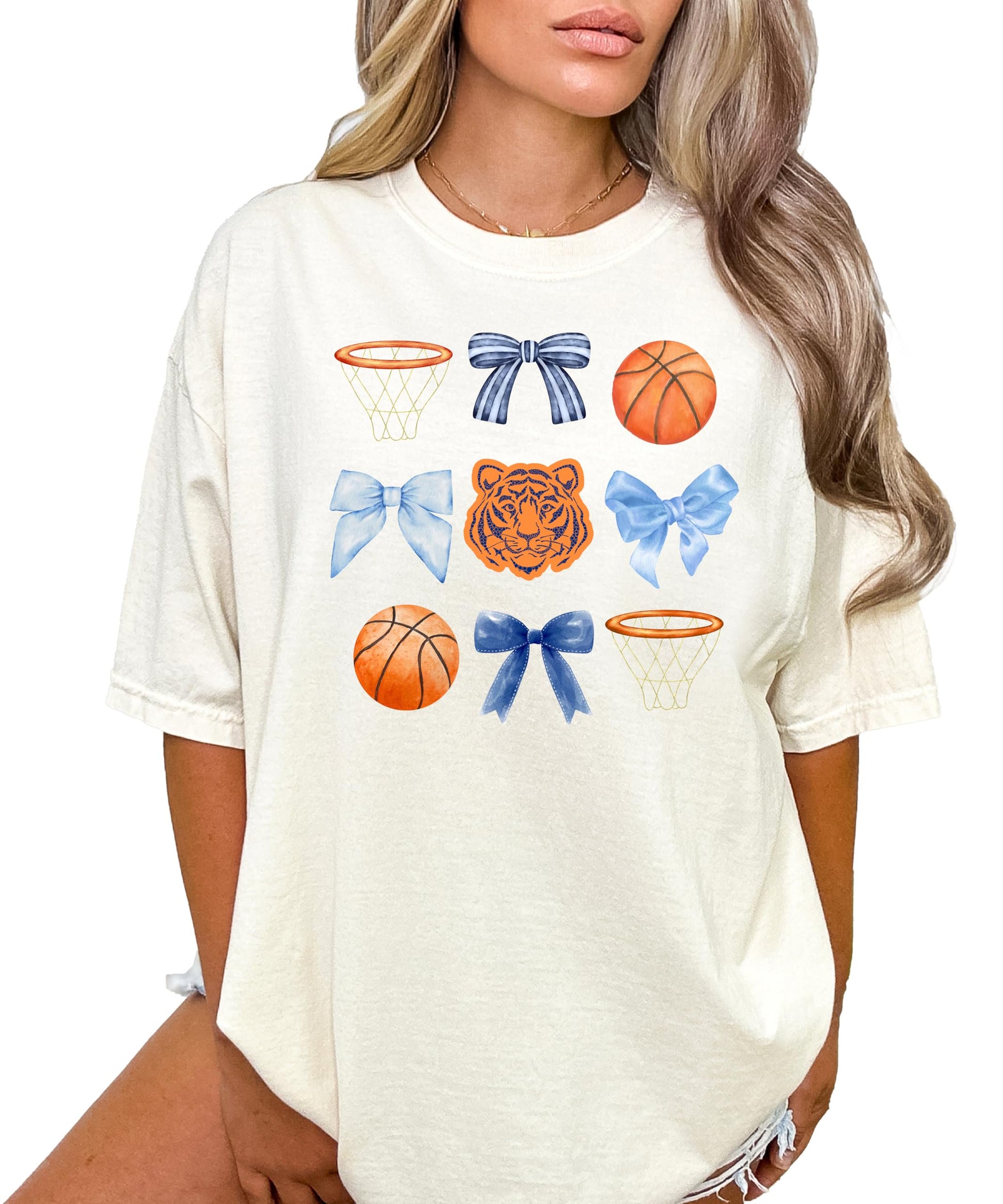 Close-up of Tigers basketball bow graphic print on ivory women's tee
