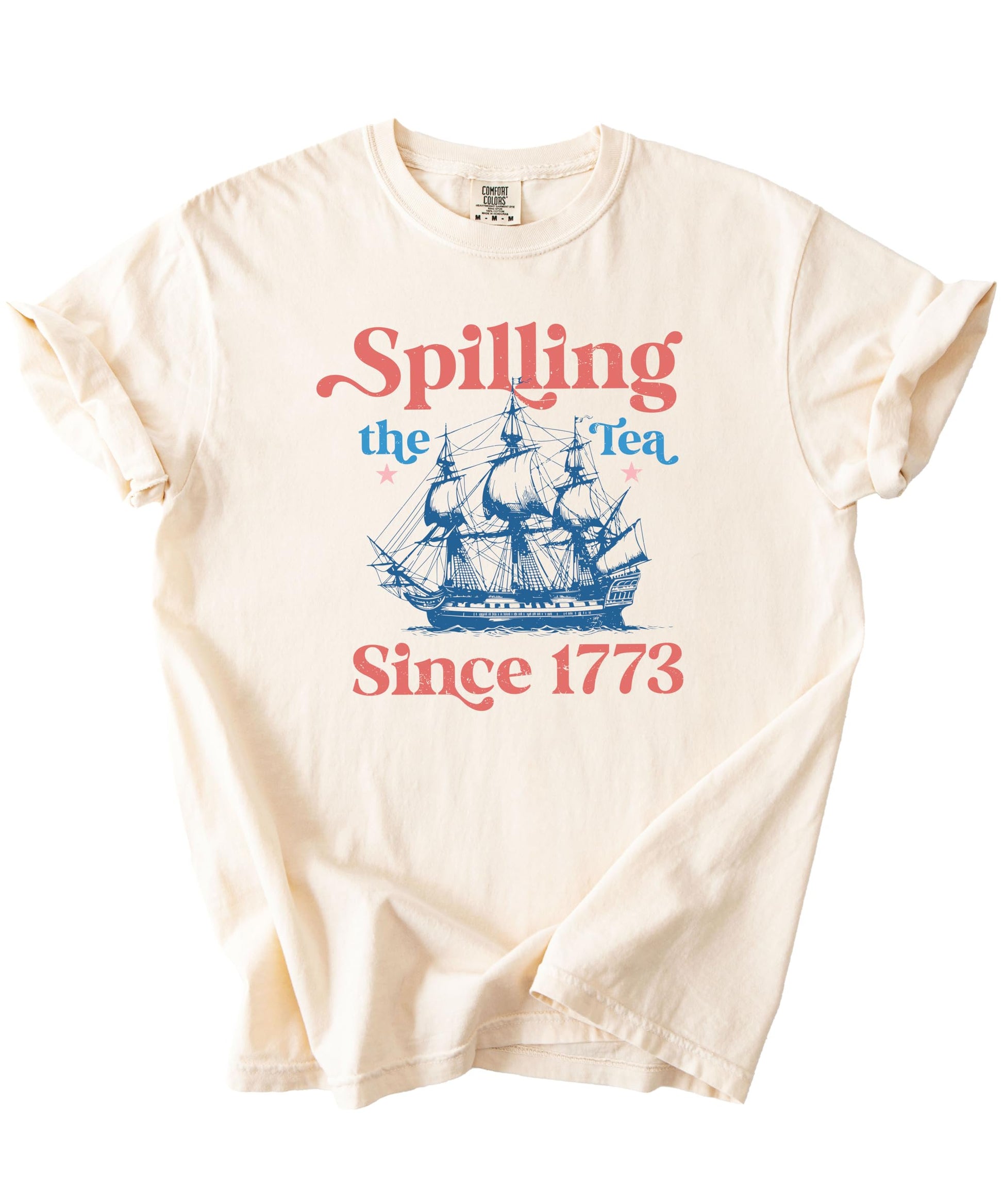 Flat lay of ivory Spilling The Tea Since 1773 shirt displaying full design