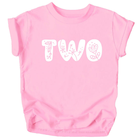 Detail shot of soft fabric and vibrant floral print on toddler birthday tee
