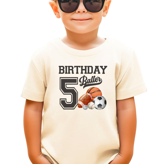 Black kids tee with Birthday Baller 5th birthday sports graphic for boys