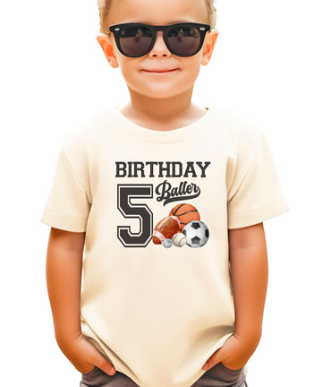 Black kids tee with Birthday Baller 5th birthday sports graphic for boys