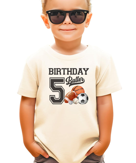 Black kids tee with Birthday Baller 5th birthday sports graphic for boys