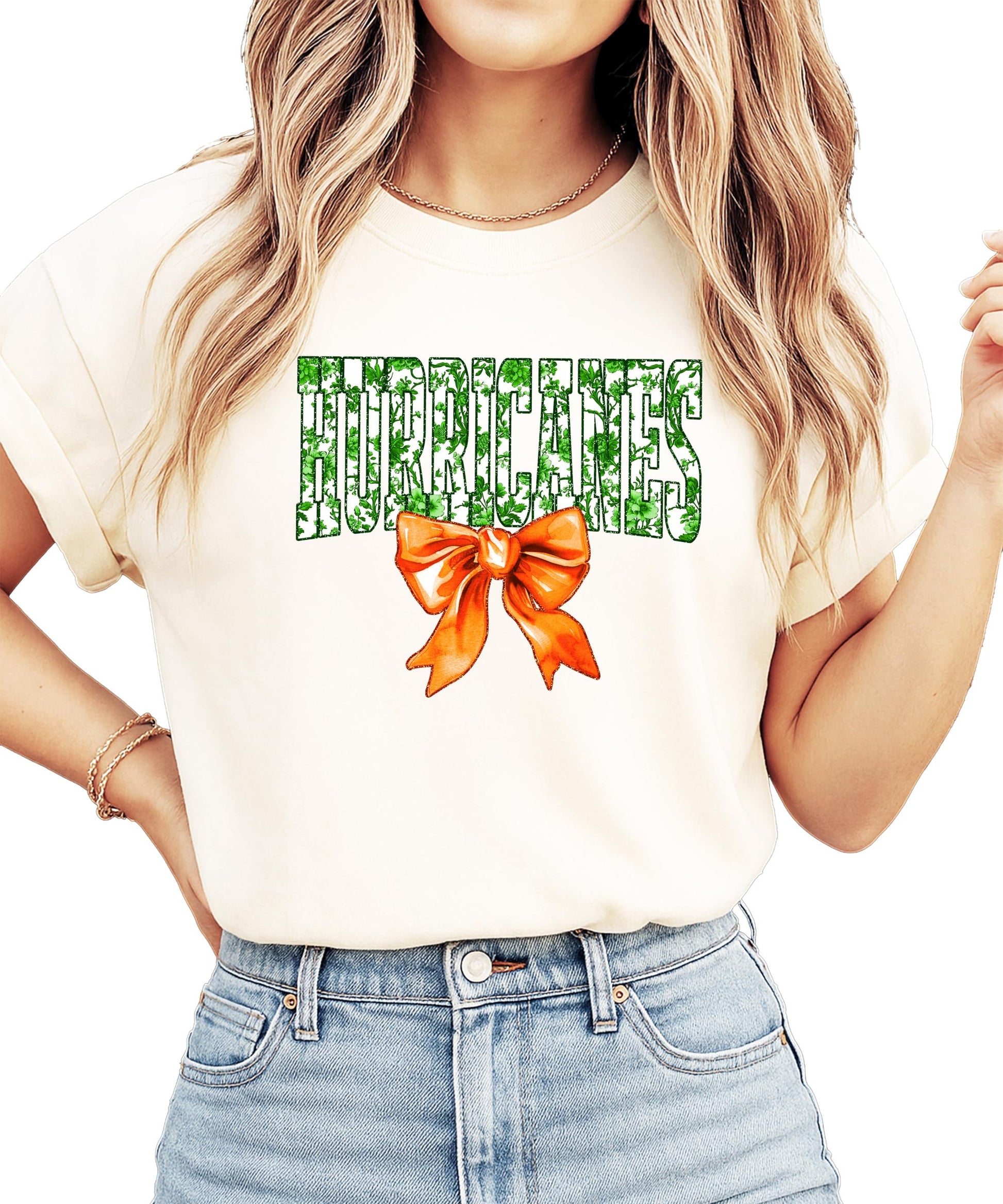 Full layout flat lay of Hurricanes green floral orange bow graphic tee for women and teens