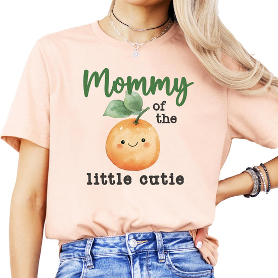 Flat lay of One Little Cutie peach orange birthday bodysuit from Olive Loves Apple