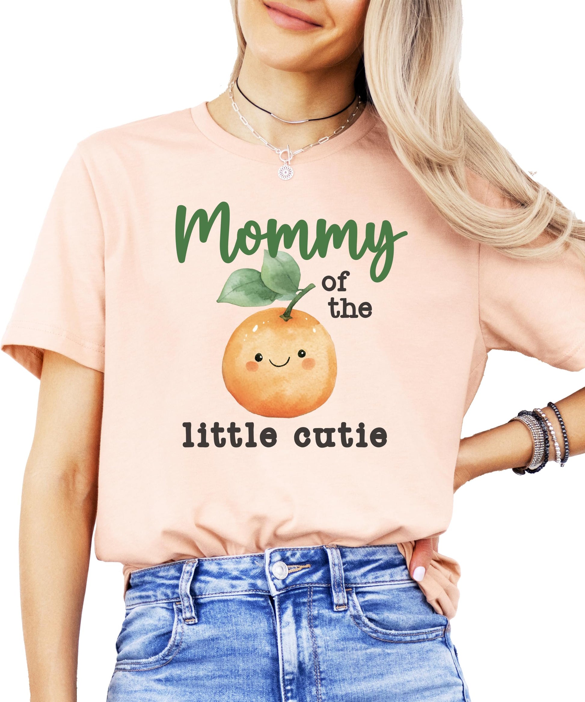 Flat lay of One Little Cutie peach orange birthday bodysuit from Olive Loves Apple