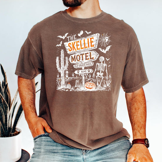 Flat lay of Skellie Motel Halloween unisex graphic tee showcasing full design and seafoam colorway