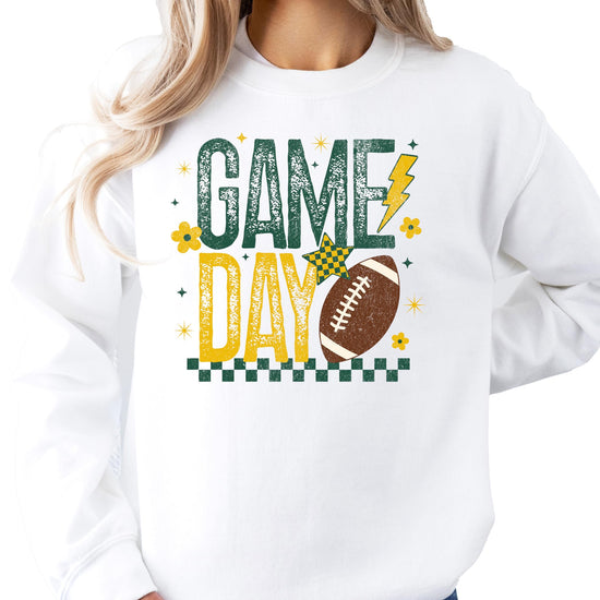 Model wearing green yellow football graphic sweatshirt casual styling