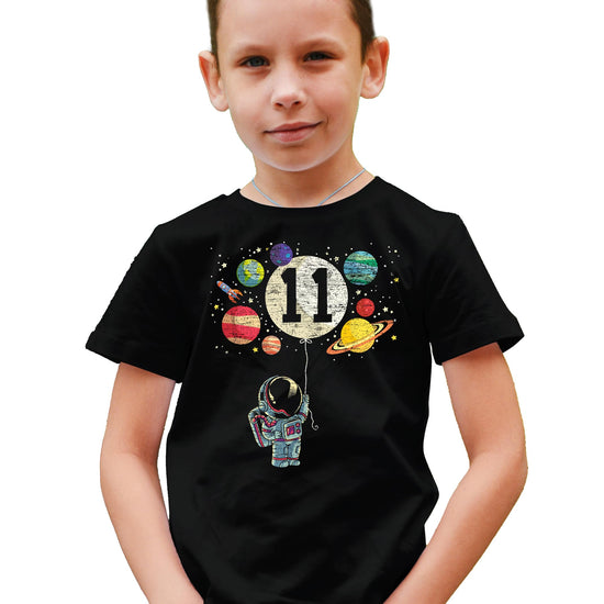 Front view of youth space birthday tee with colorful planet and rocket design
