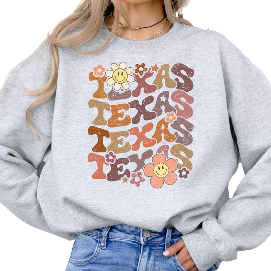 Texas sports sweatshirt laid flat showing full colorful flower design