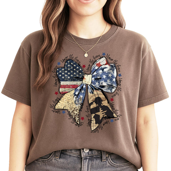 Close-up of Honor The Brave patriotic bow graphic print on women's blue graphic tee
