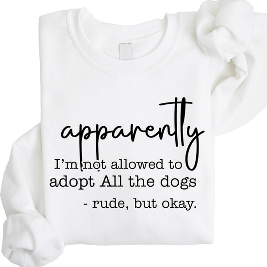 Close-up view of black text design on gray sweatshirt about adopting all the dogs